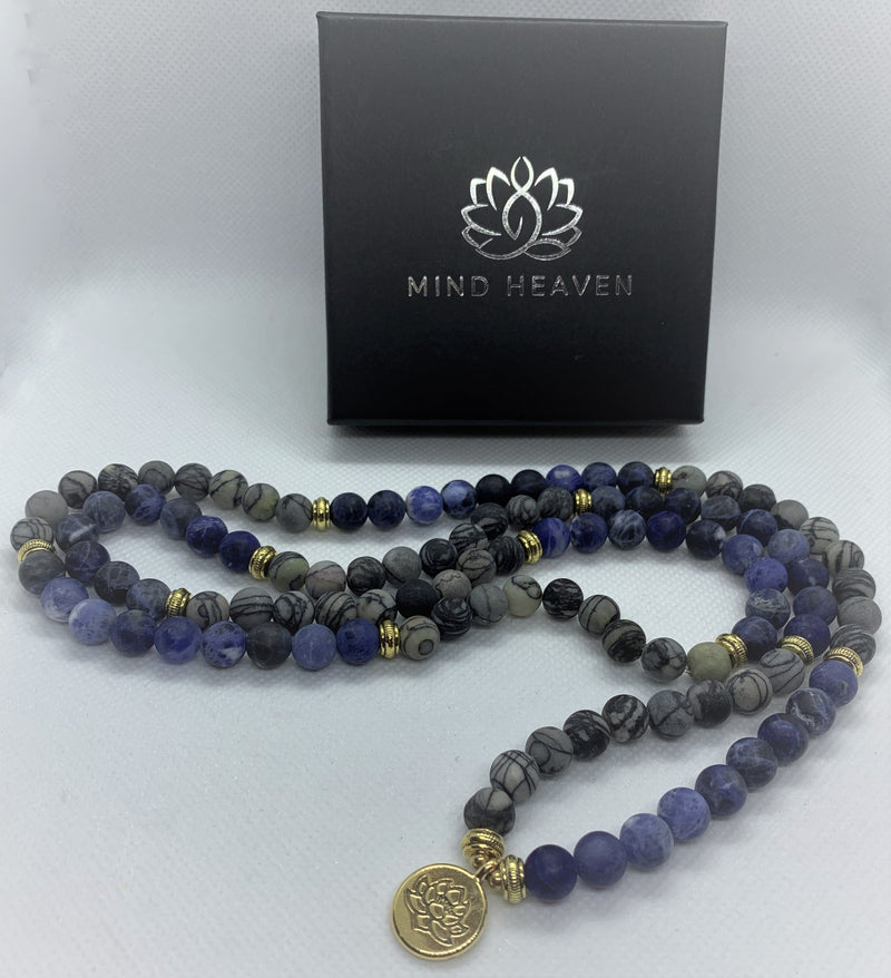 Natural Blue Picasso Marble Mala with golden Lotus looks modern with aesthetic appeal. You can wear it on your hand like a wrist mala/bracelet or around your neck.