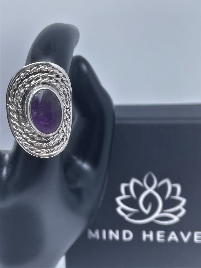 Oval doted silver ring with amethyst or pink quartz crystal stone