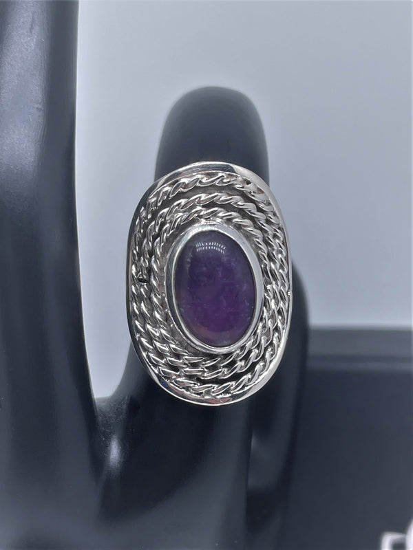 Oval doted silver ring with amethyst or pink quartz crystal stone