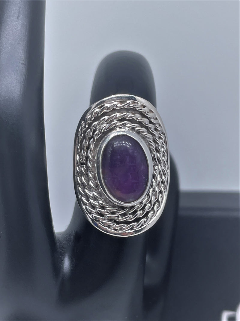 Oval doted silver ring with amethyst or pink quartz crystal stone