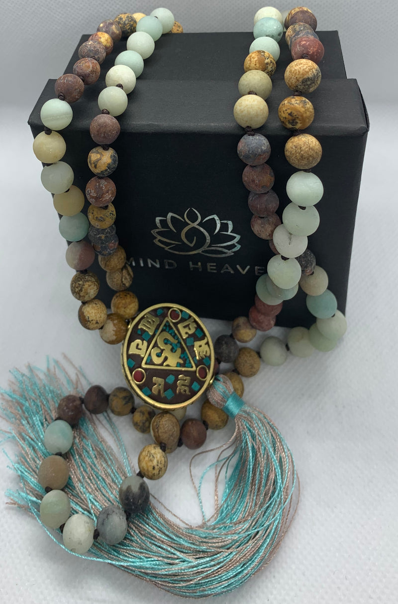 Nepal beads featuring Picasso Jasper and Amazonite stones beads 108 Hand made mala necklace with Hum tassel in aqua colors.