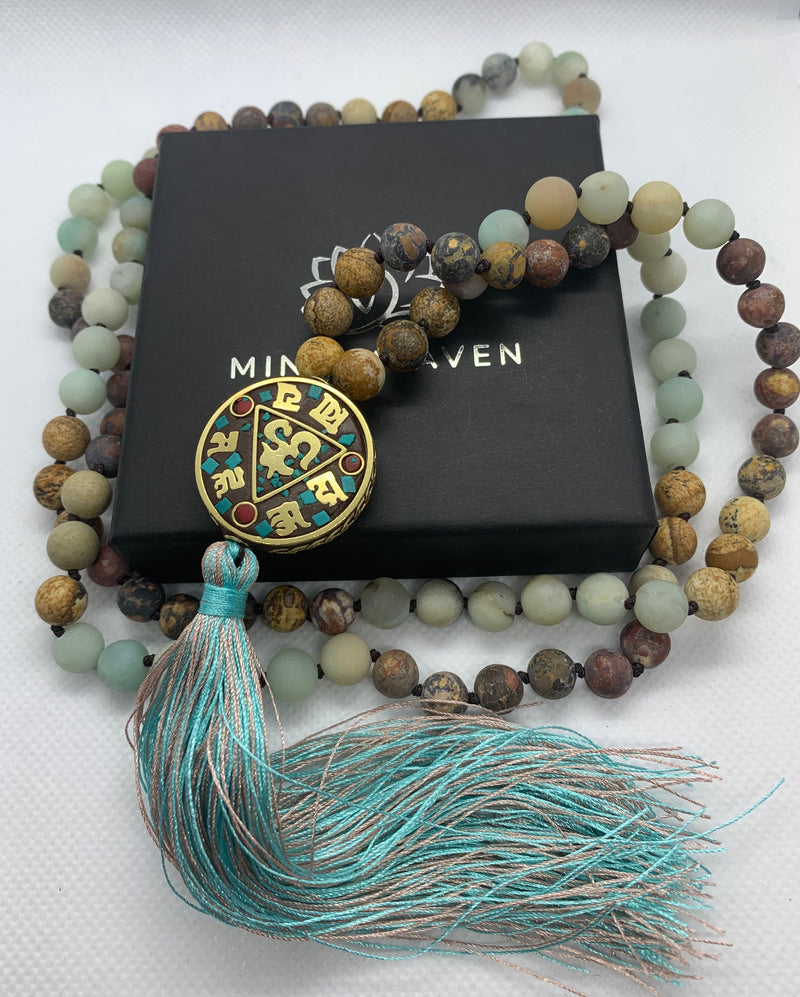 Nepal beads featuring Picasso Jasper and Amazonite stones beads 108 Hand made mala necklace with Hum tassel in aqua colors.