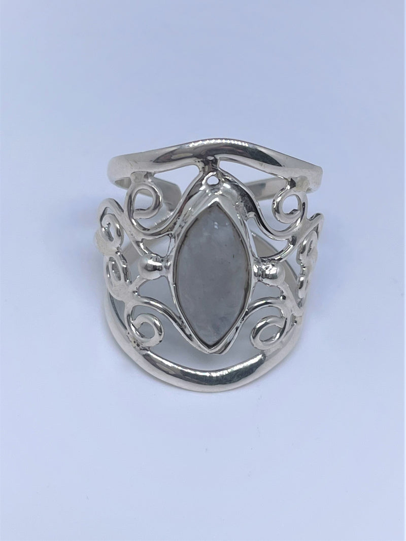The mysterious glow of this oval moonstone cabochon is beautifully presented in this textured and polished sterling silver ring. It will make a gorgeous statement with any ensemble. 1" wide. Moonstone scrollwork ring.