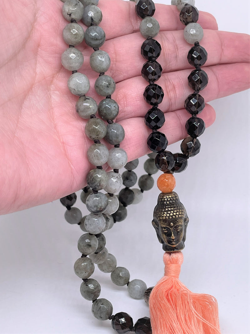 Necklace features Labradorite, Smoky Quartz and sunstone with Buddha face as guru pendant and orange tassel