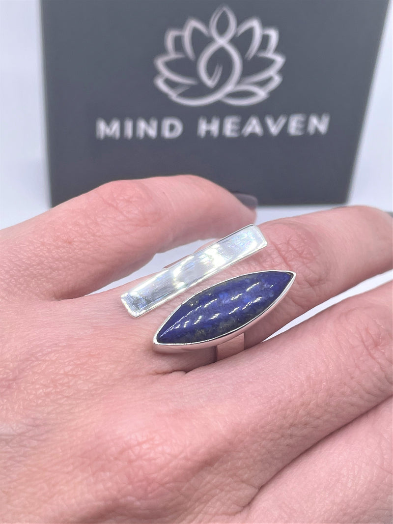 Bold, blue, and beautiful will definitely stand out, with its unique oval gemstone and silver line with sterling silver band. The oval lapis lazuli gemstone adds the perfect pop to any of your favorite looks. Pyrite flecks will vary. Two-tone