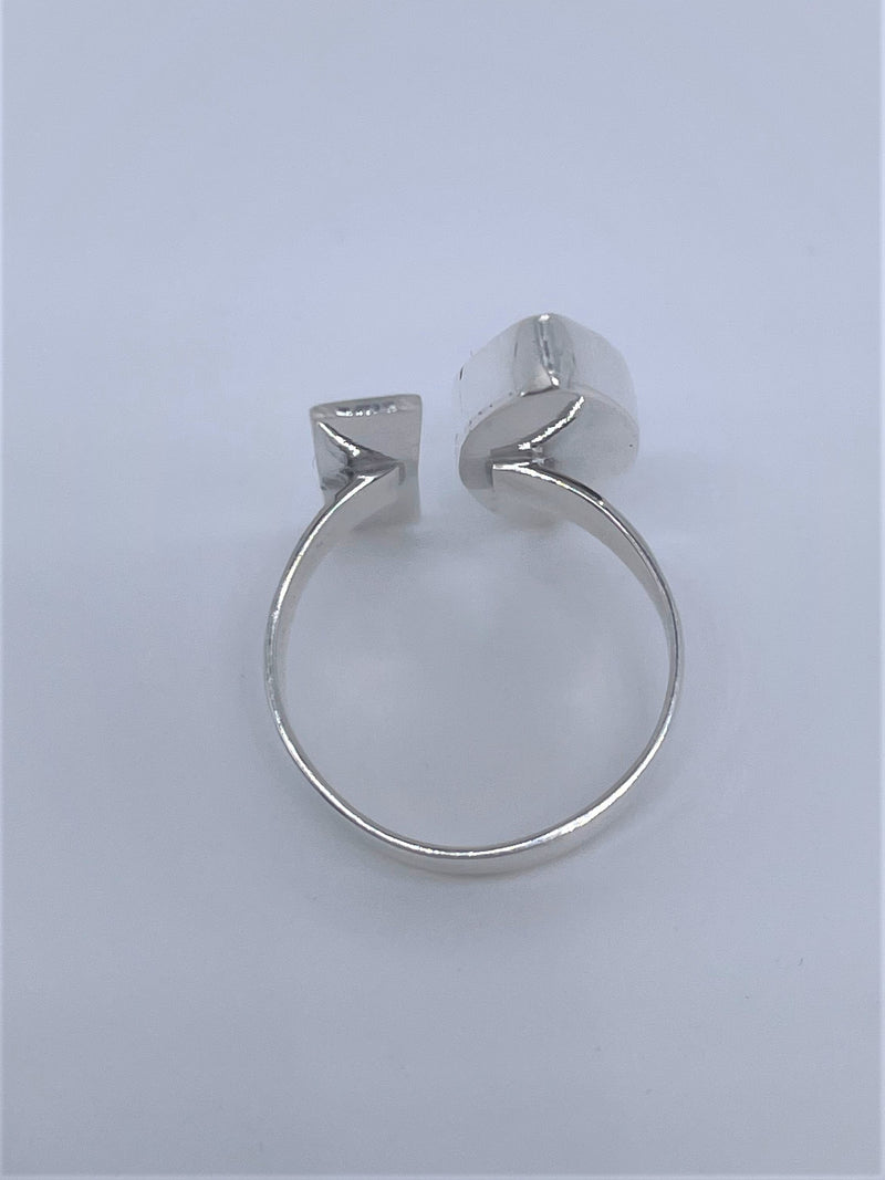 Bold, blue, and beautiful will definitely stand out, with its unique oval gemstone and silver line with sterling silver band. The oval lapis lazuli gemstone adds the perfect pop to any of your favorite looks. Pyrite flecks will vary. Two-tone