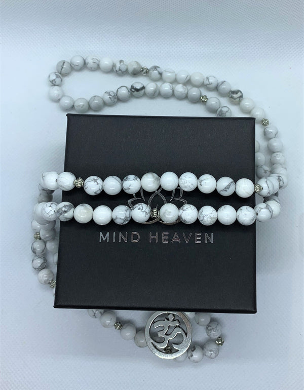 Howlite is often worn as a reminder of patience. The marbled stone is associated with inner calm, stress release, and soothing an overactive mind.   The Om symbol is the fundamental representation of the sound that originates from all living beings.