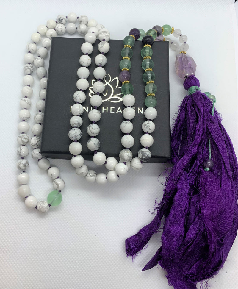 "Mynd-Energy" is a unique 108 hand-made necklace that features Amethyst and White Turquoise with fabric tassel and Amethyst Guru bead. Necklace multicolor