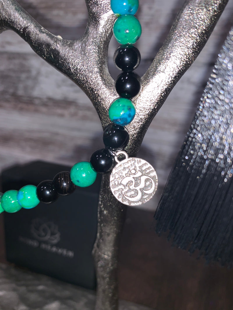 Elegant Black Onyx and Chrysocolla 108 Mala Necklace with black tassel and OM pendant.   This beautiful 108 hand-made mala necklace features Black Onyx and Chrysocolla Beads with black tassel and OM pendant