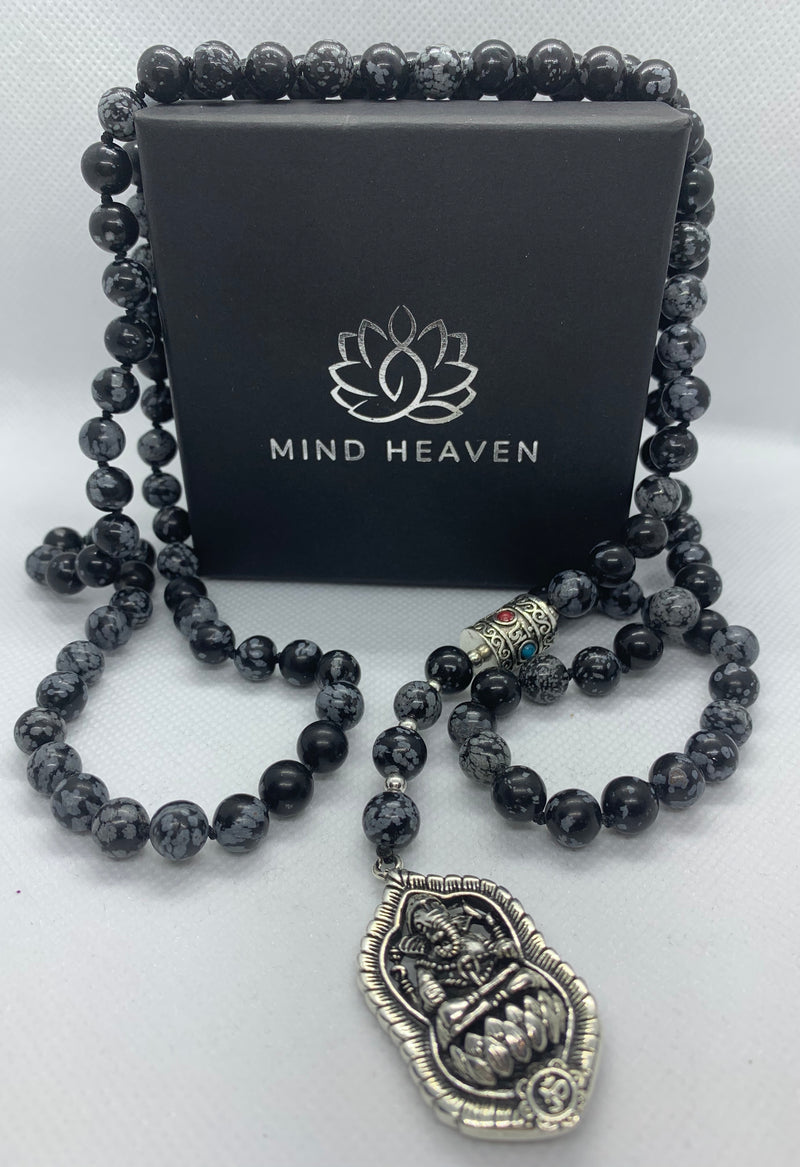 "Mynd-Success" This Stunning and elegant 108 hand-made mala necklace features snowflake obsidian with Ganesha pendant