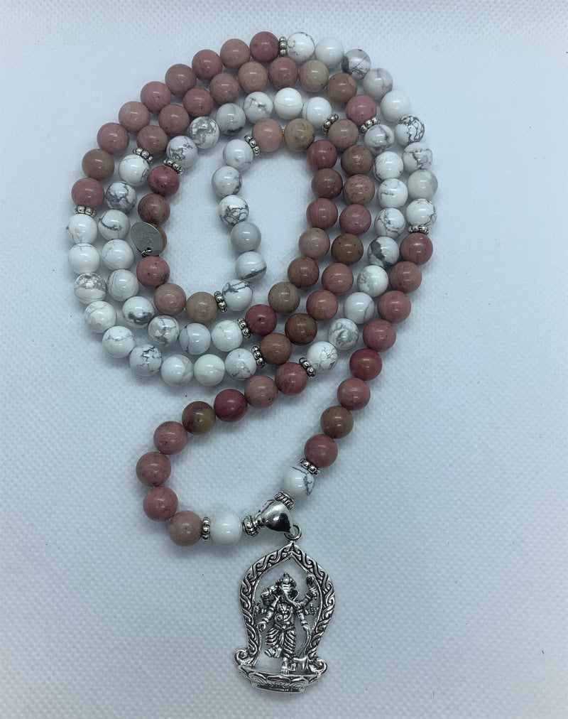 "Mynd-Inspiration" is a Stunning and elegant 108 hand-made mala necklace features black and white snowflakes with a Ganesha pendant. Bracelet
