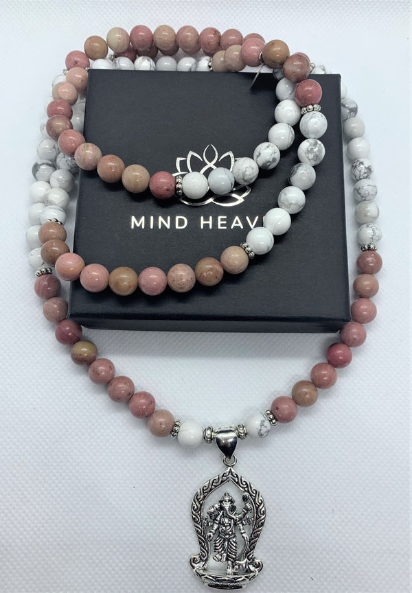 "Mynd-Inspiration" is a Stunning and elegant 108 hand-made mala necklace features black and white snowflakes with a Ganesha pendant. Bracelet