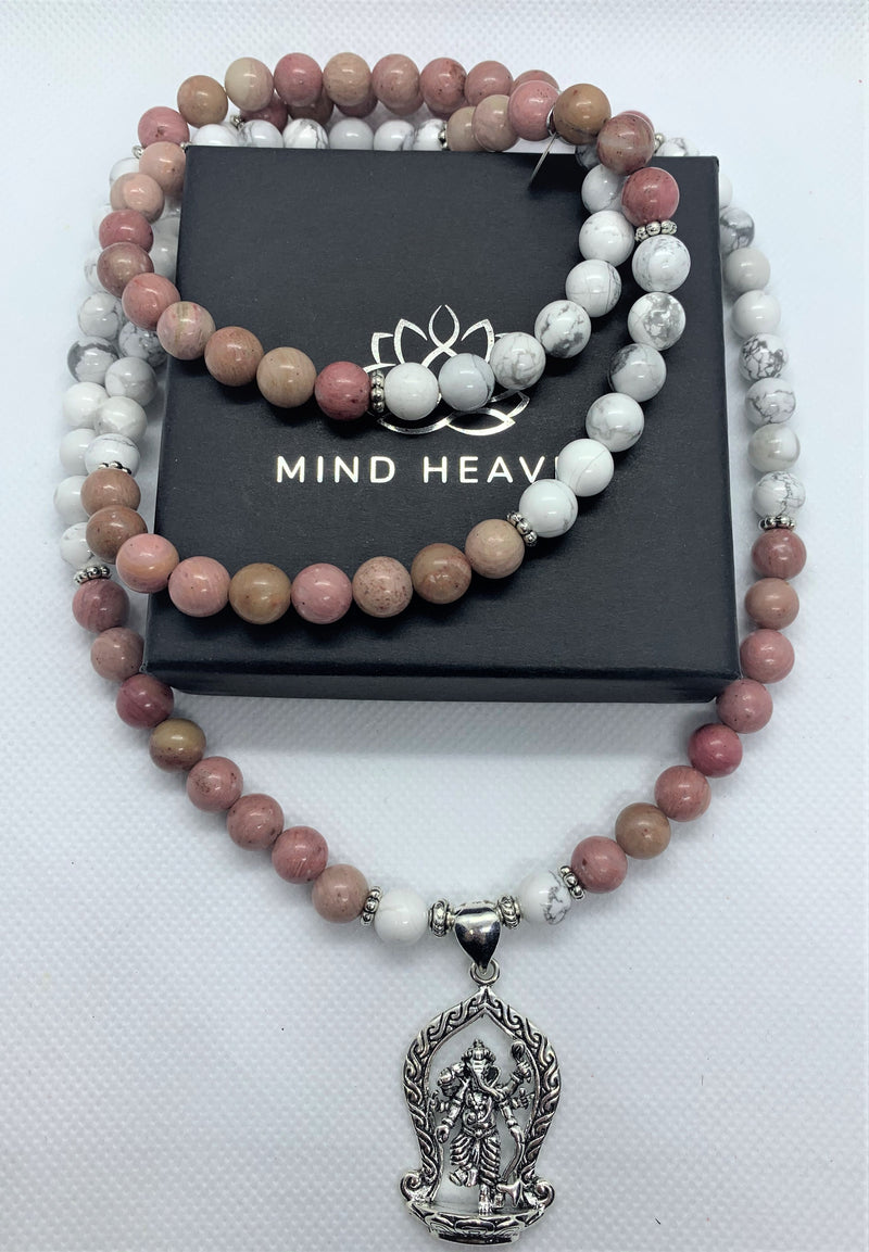 "Mynd-Inspiration" is a Stunning and elegant 108 hand-made mala necklace features black and white snowflakes with a Ganesha pendant. Bracelet