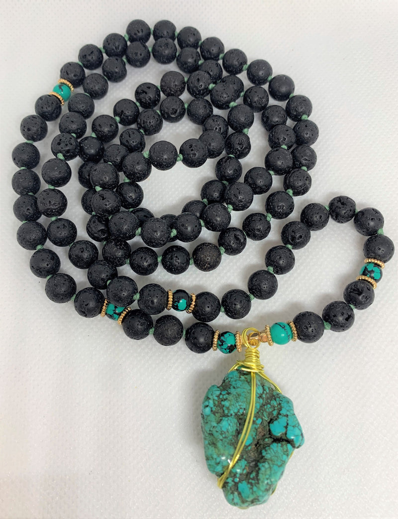 “Mynd-Clear” This exclusive 108 hand-made mala beads necklace features Lava stone beads and a beautiful and unique Turquoise pendant.