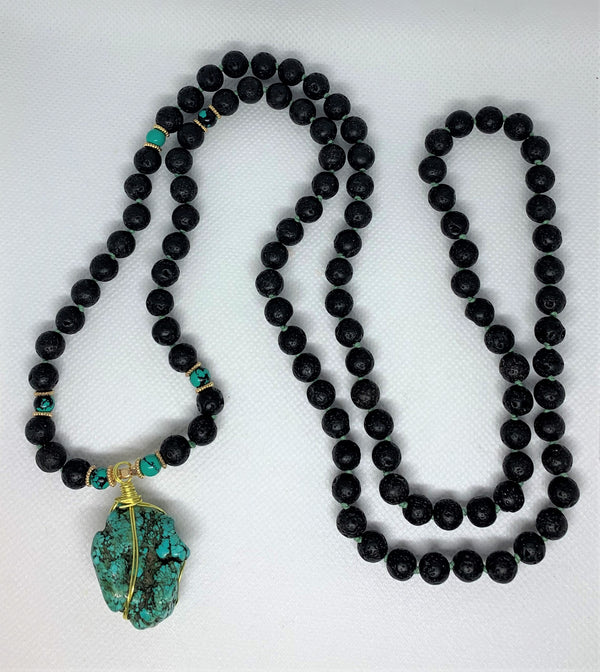 “Mynd-Clear” This exclusive 108 hand-made mala beads necklace features Lava stone beads and a beautiful and unique Turquoise pendant.