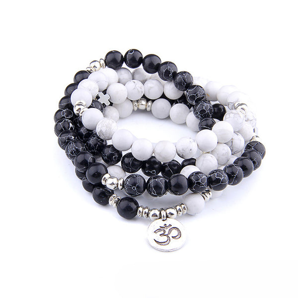 "Mynd-Emotion" Is an Elegant Hand-Made 108 Mala beads that feature White Turquoise and Black Sea sediment Jasper beads with OM pendant / necklace or bracelet