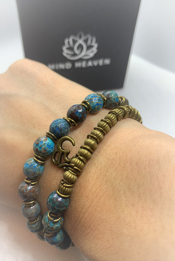 "Love-me" wrist mala Is an Elegant Hand-Made bracelet that features Ocean Jasper beads with OM pendant.