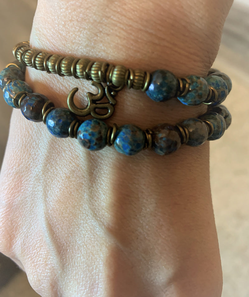 "Love-me" wrist mala Is an Elegant Hand-Made bracelet that features Ocean Jasper beads with OM pendant.