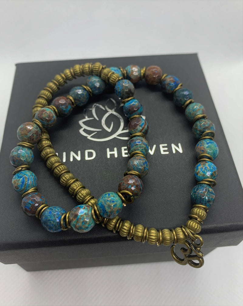 "Love-me" wrist mala Is an Elegant Hand-Made bracelet that features Ocean Jasper beads with OM pendant.